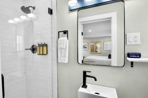 a bathroom with a sink and a mirror at Haley's at Anna Maria Island Inn in Holmes Beach