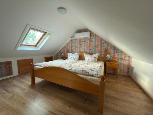 a bedroom with a bed in a attic at klimatisiertes, gemütliches Ferienhaus in Koblenz