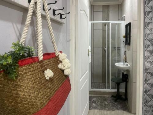 a bathroom with a towel hanging from a door at Nestled Peace in Klerksdorp