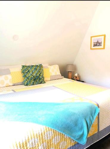 a bedroom with a large bed in a attic at Sunset n Chill in Sunset Beach