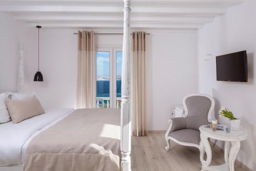 Ένα ή περισσότερα κρεβάτια σε δωμάτιο στο Mykonos Princess Hotel