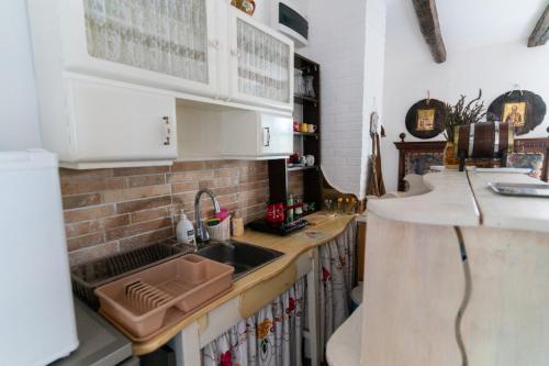 a kitchen with a sink and a counter top at Matejev konak in Šušara