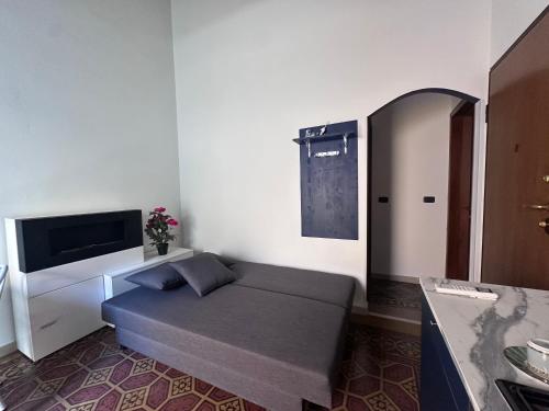 a room with a bed in the corner of a room at L'Angolo di Luce in Falconara Marittima