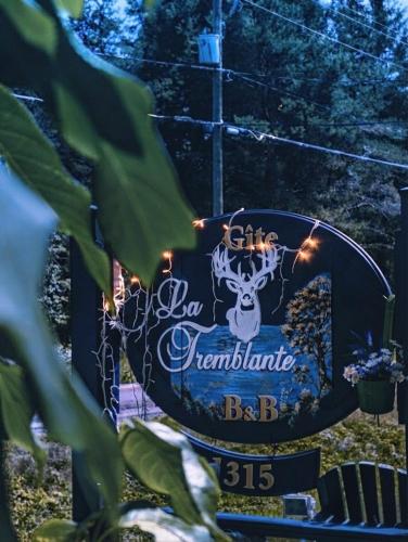 a sign for a bar with lights on it at La Tremblante in Mont-Tremblant