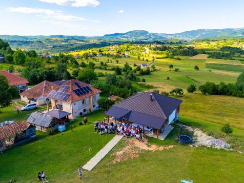 an aerial view of a group of people standing outside a house at Seosko domaćinstvo Kastratović in Berane