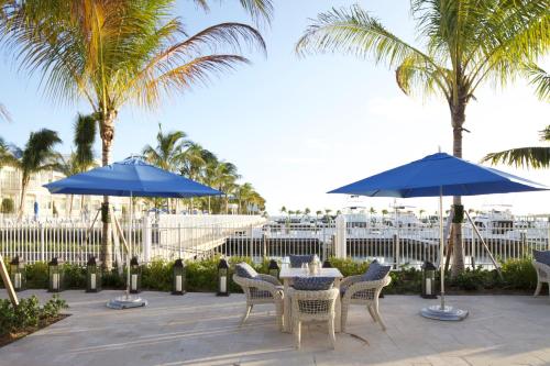 a beach area with umbrellas and chairs at Oceans Edge Key West in Key West