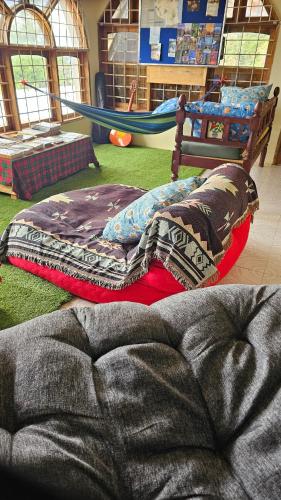 a bedroom with a bed and a play area at Wood & Net in Iringa