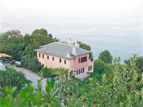 an aerial view of a house next to the water at Villa Aglaini in Agios Dimitrios
