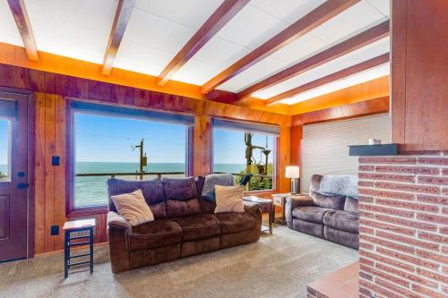 a living room with a couch and a table at The Nook on Chinook in Tillamook