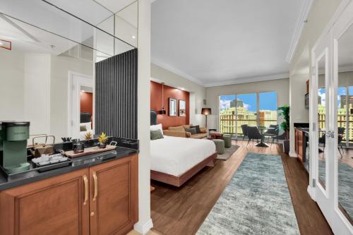 a hotel room with a bed and a bathroom at Luma Vera Penthouse Sanctuary Strip Views in Las Vegas