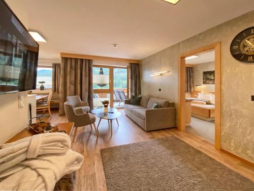 a living room with a couch and a table at Chesa Arella in Serfaus
