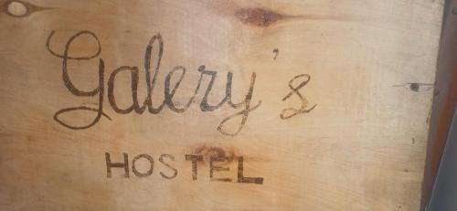 a sign that says jellitus hashtm written on a wooden table at Vintageshvili hostel and guest house in Tbilisi City