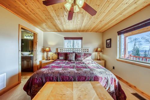 a bedroom with a bed and a ceiling fan at Brian Head 'View-Topia' w/ Mtn Views & King Suite in Brian Head