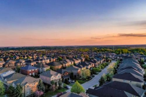 an aerial view of a suburb at sunset at Havenly Homes DMV in Arlington