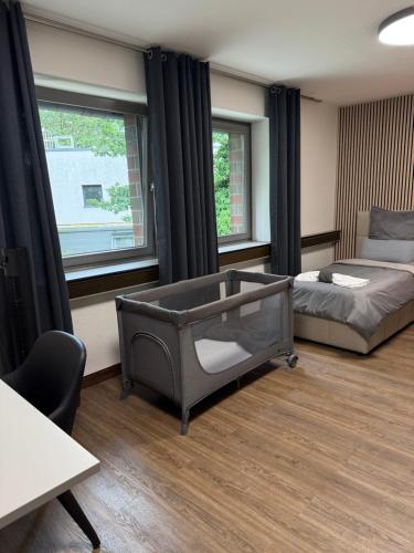 a bedroom with a bed and a large window at Garland-Rooms in Bremen