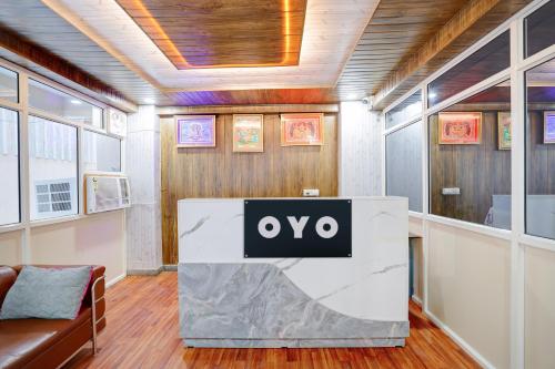 an office with an ovo sign on a table at Hotel O M3M Paradise in Bhiwadi