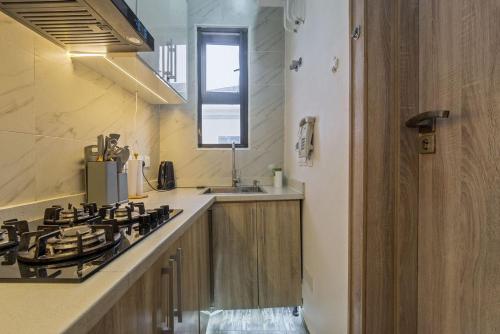 a kitchen with a stove and a sink at Zuma Tan in Lagos