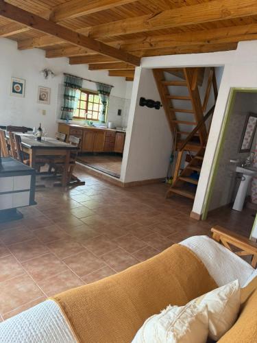 a living room with a couch and a table at Selene Malen 5 in Villa Pehuenia