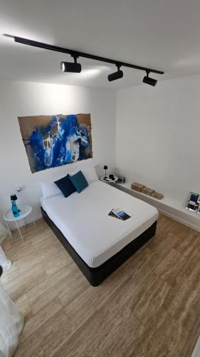 a bedroom with a large bed in a room at Suite Marina Gallega in Oya
