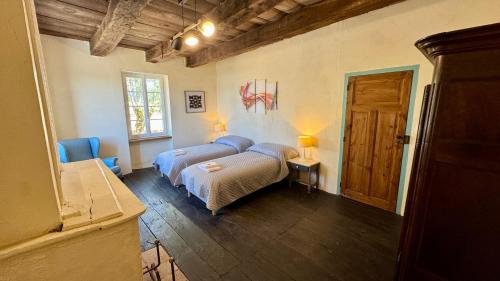 a bedroom with a bed in a room at Les Vieilles Planches in Pampelonne