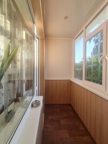 a bathroom with a window and a white sink at 43 Квартира in Bila Tserkva