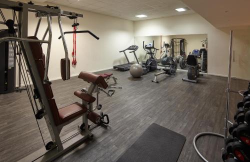 a gym with several exercise equipment in a room at Melpo Antia Hotel & Suites in Ayia Napa