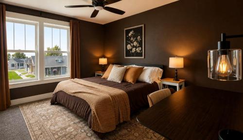 a bedroom with a bed and a table and a window at Walkable to Parks, Yellowstone River, Coffee Shop in Billings