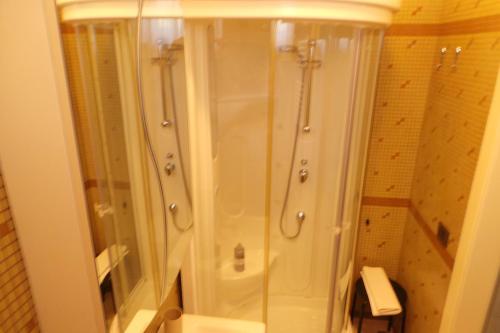 a shower with a glass door in a bathroom at La casa di Mazzancollo in San Martino in Pensilis