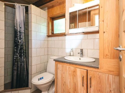 a bathroom with a toilet and a sink and a shower at 8 person holiday home in Hovborg-By Traum in Hovborg