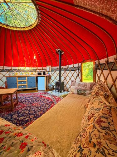 a room with a bed in a yurt at Cotswolds Camping at Holycombe in Shipston-on-Stour