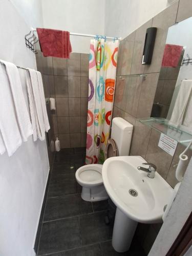 a bathroom with a toilet and a sink at vila gira odeceixe in Odeceixe