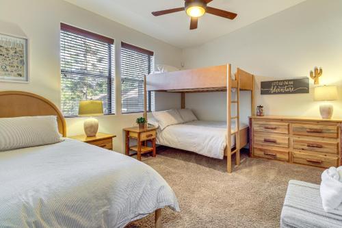 a bedroom with two beds and a bunk bed at Hot Tub, Deck & Grill! Mtn Retreat in Show Low in Show Low
