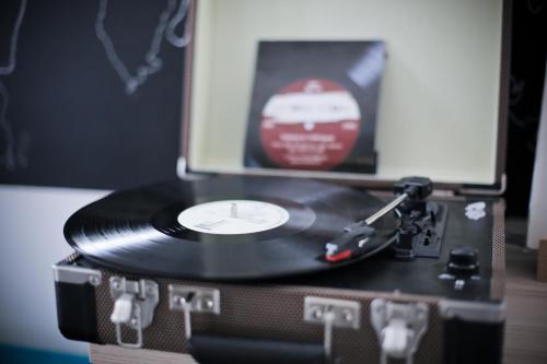 a record player with a cd on top of it at 4citywindows in Zagreb