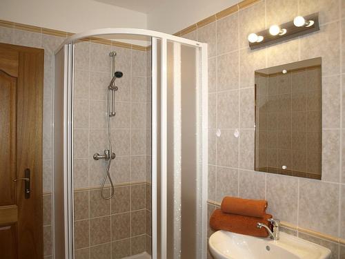 a bathroom with a shower and a sink at Vila BEBA in Tatranská Lomnica