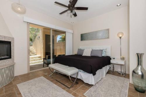 a bedroom with a bed and a ceiling fan at Bella Sirena Villa 8 - Your Dream Coastal Escape in Puerto Peñasco