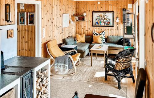 a living room with a couch and a table at Stunning Home In Seim With Wifi in Seim