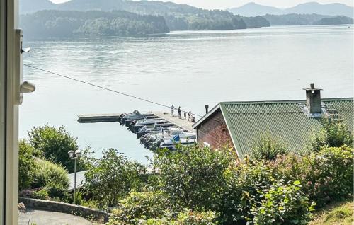 a group of people on a dock on the water at Stunning Home In Seim With Wifi in Seim