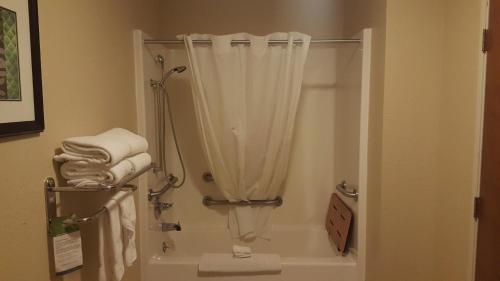 a bathroom with a shower with a shower curtain at Best Western Central City in Central City