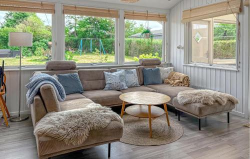 a living room with a couch and a table at Gorgeous Home In Haderslev With Wifi in Haderslev