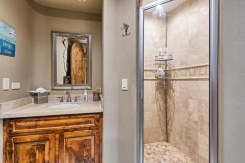 a bathroom with a shower and a sink at Bella Sirena 305-A - Elegant Oceanview Condo on Beachfront Resort in Puerto Peñasco