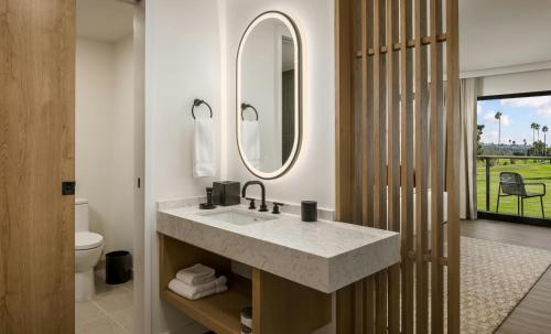a bathroom with a sink and a mirror at Guesthouse Hotel at La Valle in Rancho Santa Fe