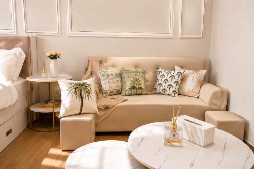 a living room with a couch and a table at LuxeInn in Trece Martires