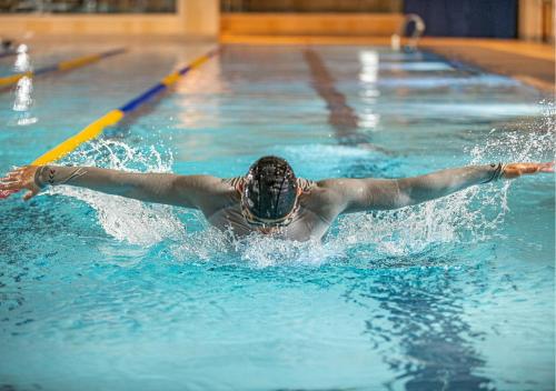 a swimmer in a swimming pool in the water at Kerry Hotel, Beijing by Shangri-La in Beijing