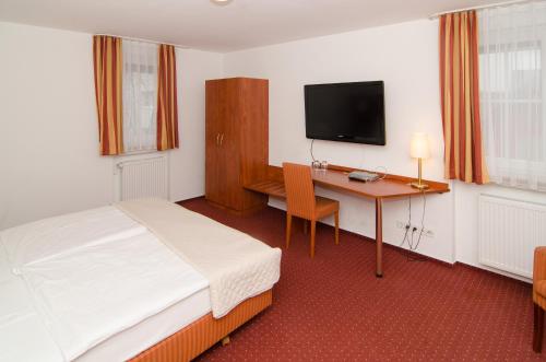 Кровать или кровати в номере Hotel -Restaurant Taormina