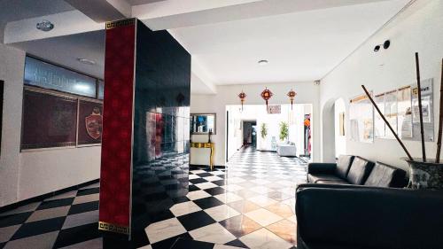 a lobby with a black and white checkered floor at Hotel Beijing Cartagena in Cartagena de Indias