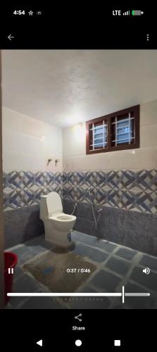 a bathroom with a toilet in a room at Cherry guest House Shringeri ,koppa rural in Chikmagalur