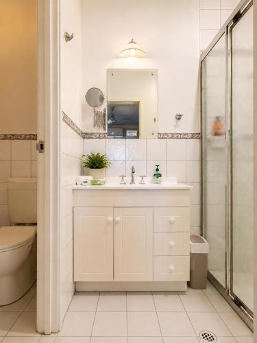a bathroom with a sink and a shower at Pecan Hill BNB in Toodyay