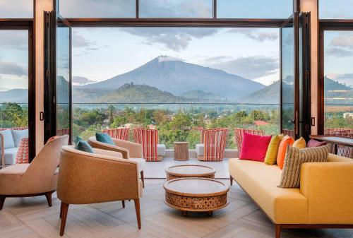 a living room with a view of a mountain at Gran Meliá Arusha in Arusha