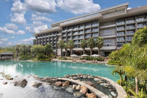 a hotel with a swimming pool and a resort at Gran Meliá Arusha in Arusha