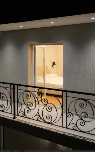 a balcony with a mirror and a bed at Hotel Luxury Palace in Ishull-Lezhë